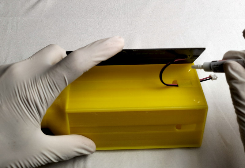 Apply glue at each corner